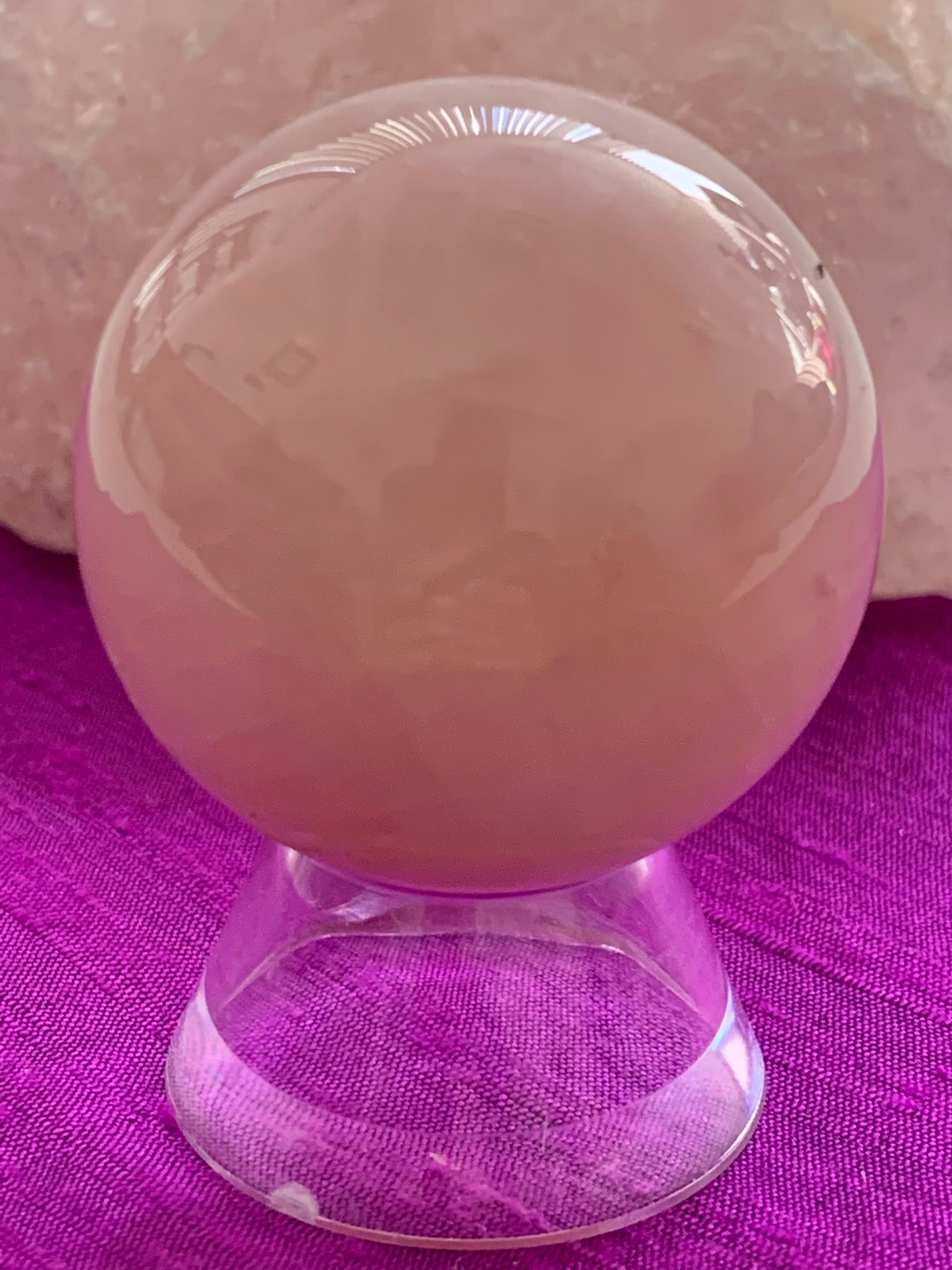 Close-up view with stand. High quality Rose Quartz sphere is perfect for your altar, meditation space or to hold while meditating, or anywhere you want to radiate the energy of love ♥. Rose quartz is the "stone of unconditional love & infinite peace." It opens the heart and soothes emotional distress. Size is approximately 2"/40mm. Plastic stand as seen in photo, is included with your purchase.