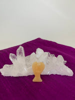 Load image into Gallery viewer, Lovely honey calcite angel is perfect for your altar, meditation space, to hold while meditating, or anywhere you want to cleanse, clear negative energy or increase spiritual connection. Honey calcite helps lift your energy and cleanse the atmosphere or your own personal energy. It also increases spiritual connection and psychic abilities, bringing higher energies into the body, relieving worries and bringing serenity. It also eases the challenges that come with change. Size is approximately 1½&quot;. 
