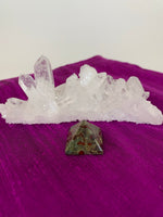Load image into Gallery viewer, Powerful dragon blood (aka dragon stone) pyramid is perfect for your altar, meditation space or anywhere you want to radiate the energy of courage. Dragon stone jasper (a variety of quartz) is a stone of strength, courage and personal power. It enhances creativity and also attracts both money and love (themagicisinyou.com). It is also said to increase fertility. Size is approximately1&quot;x1&quot;. 
