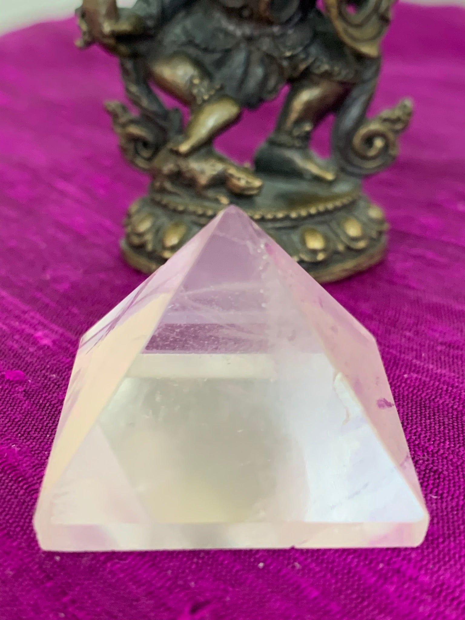 Close-up view. Powerful clear quartz pyramid is perfect for your altar, meditation space or anywhere in your home or office. This pyramid is cloudy or milky in appearance - more translucent than the other clear quartz pyramids. So, the clear vs the cloudy - it's all in the eye of the beholder ;). Quartz is the "most powerful healing and energy amplifier on the planet" (Judy Hall). Pyramids are used to amplify and transform energy. Approximately 1"x1".