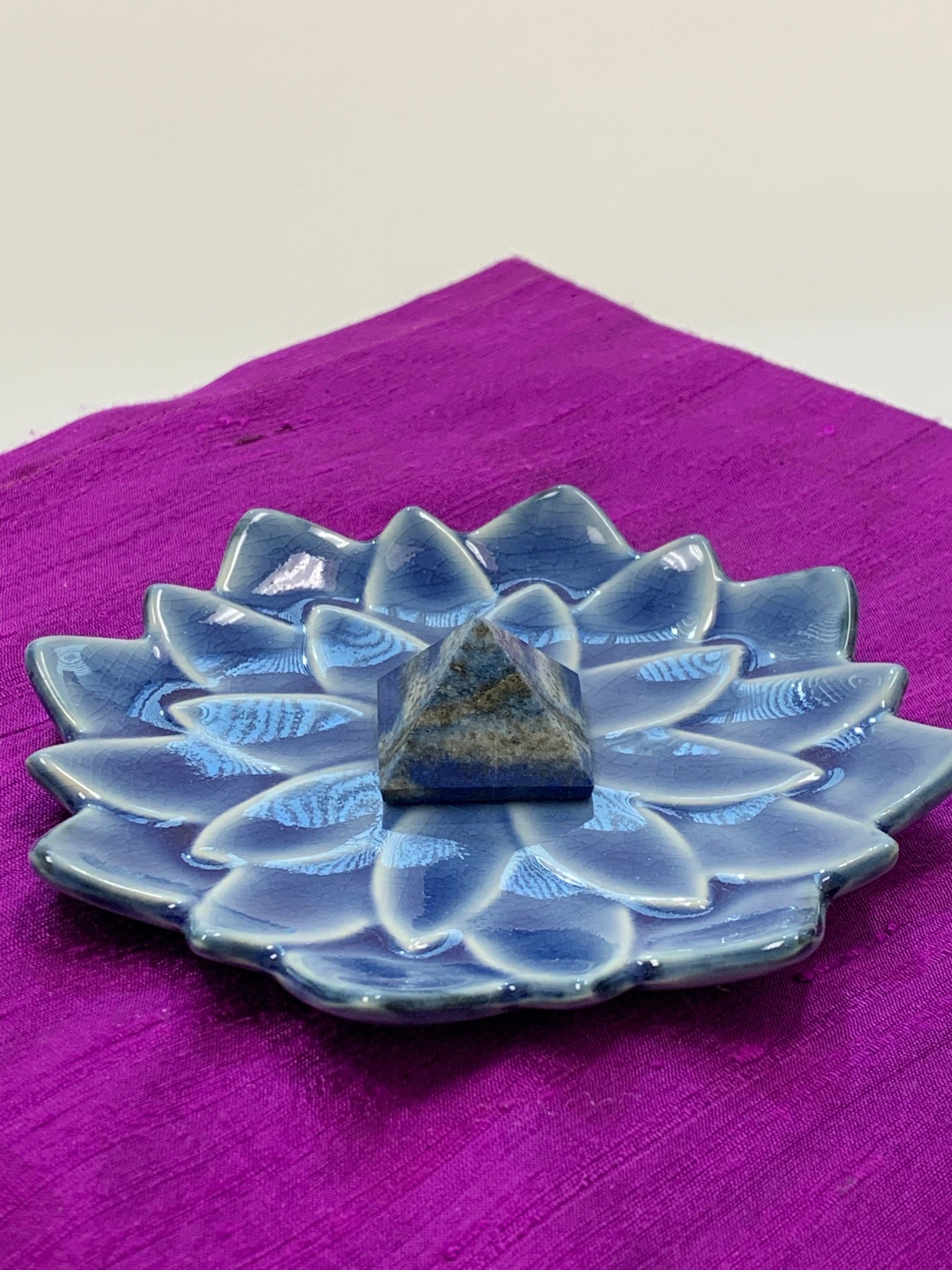 Powerful lapis pyramid is perfect for your altar, meditation space or anywhere in your home or office. Lapis enhances intuition and psychic abilities, brings peace and serenity, reveals inner truths, aids in self-expression, activates the third eye and and brings balance to the throat chakra. Pyramids are used to amplify and transform energy. Today "their likeness is used to charge crystals, herbs, pendulums, water, essential oils and other items. Approximately 1"x1".