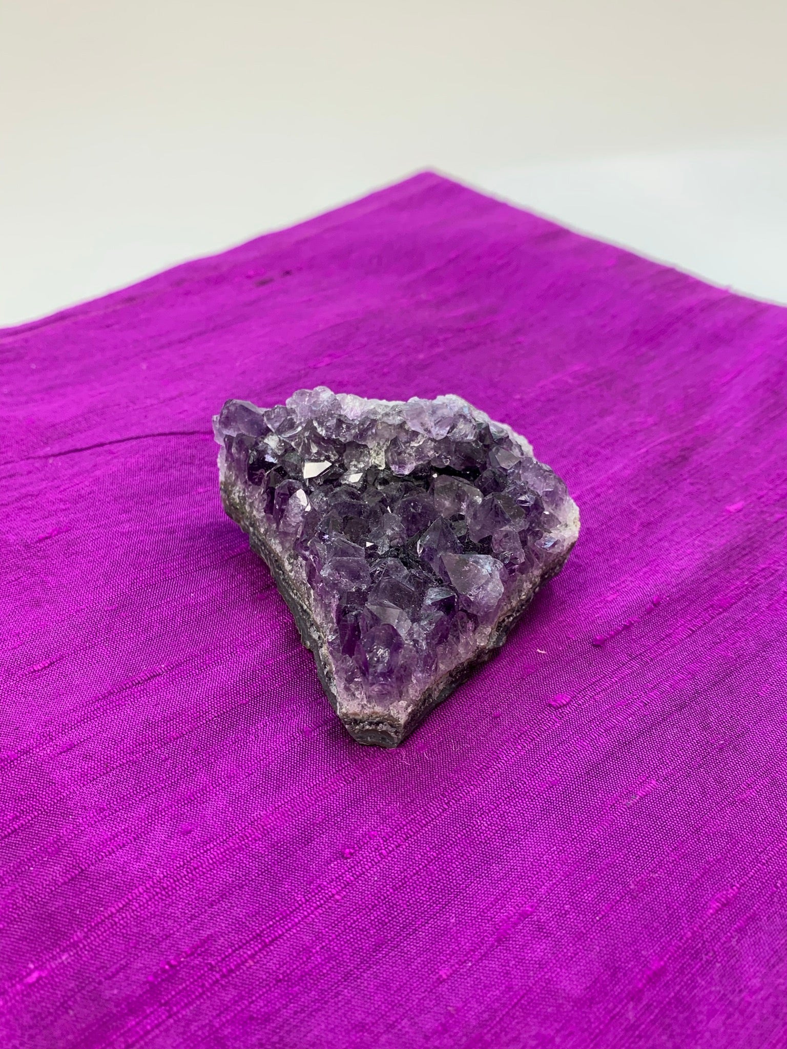 Amethyst geode piece - great quality and color. Size varies, but the average weight is 4.4oz. Each piece is unique in shape.