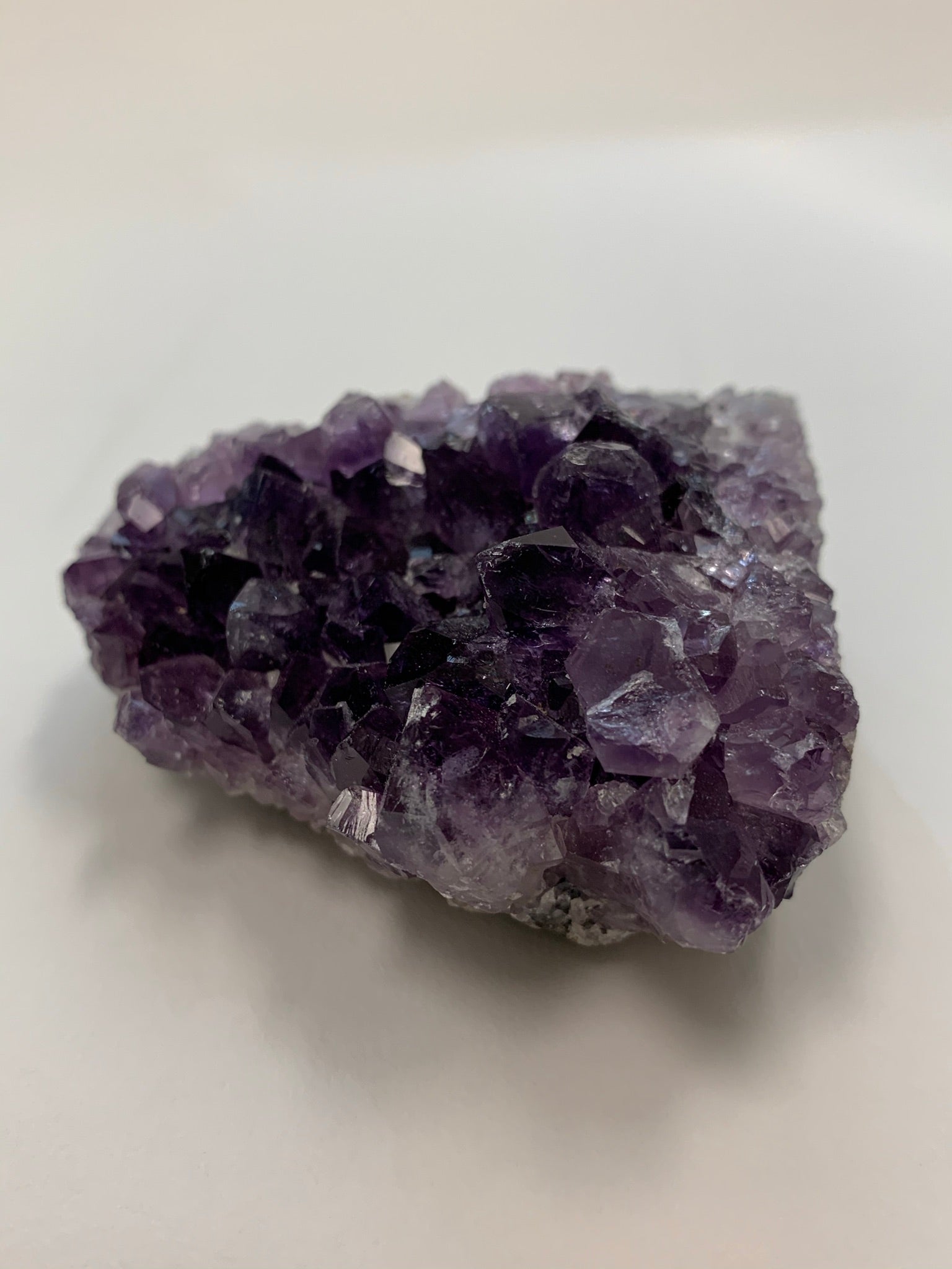 Close-up view of a different shape of the amethyst geode piece - great quality and color. Size varies, but the average weight is 4.4oz. Each piece is unique in shape.