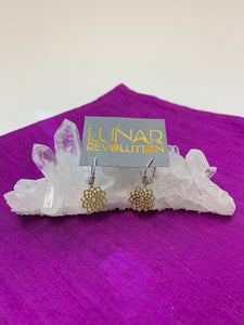 The divine mini-hoop earrings include a crown chakra charm which is hand-cast, hypoallergenic brass, accented by lavender and silver colored beads placed along the sterling silver ear wires, from which the charm dangles. The Crown chakra symbol (Sahasrara) is associated with our connection with Spirit and the Divine.