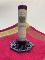 Load image into Gallery viewer, Reiki-charged pillar candle for &quot;Healing.&quot; It is handcrafted and scented using essential oils. An affirmation/prayer is printed on the label, a well as a listing of the essential oils used (lemon balm, cedar, heather, ocean). It is approximately 7&quot;x2½&quot;. Perfect for meditation, prayer, visualization or quiet time. This deep purple candle and its label are both visually appealing.
