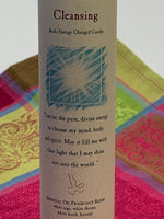 Load image into Gallery viewer, Close-up view of the label on the Reiki-charged pillar candle for &quot;Cleansing.&quot; It is handcrafted and scented using essential oils. An affirmation/prayer is printed on the label, as well as a listing of the essential oils used (white sage, white thyme, white birch, hyssop). It is approximately 7&quot;x2½&quot;. Perfect for meditation, prayer, visualization or quiet time. This white candle and its label are both visually appealing.
