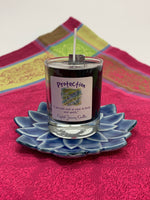 Load image into Gallery viewer, Handcrafted black votive candle in glass holder. The wax is soy-based (no paraffin) and it is also vegan. Wicks are made with paper and cotton only. This candle is for &quot;protection&quot; and an associated affirmation is printed on the label for your use - &quot;I am safe and at ease in body and spirit.&quot; 
