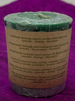 Load image into Gallery viewer, Close up of one of the 7 candles - back of label. Lovely scented set of chakra candles, one representing each of the 7 major chakras. Made with natural essential oils. They are handmade and fair trade (workers receive fair wages for their work). Comes with information/instruction sheet. Use for meditation or chakra awakening/alignment. Each candle is approximately 1.75&quot;. These candles are handmade and fair trade.
