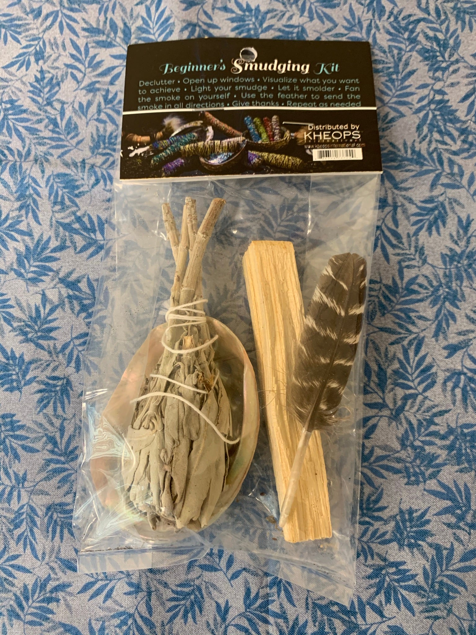 This is a mini smudging kit. It includes a small white sage smudging stick, a Palo Santo stick, a small smudging feather and a small abalone shell. Smudging with sage has its roots in Native American traditions. Use it to: *Cleanse, clear & purify your space or environment - home, office, *Cleanse, clear or purify a person & their energy *Promote healing *Promote clarity of mind *Clear out spiritual impurities *Enhance ceremony or ritual. Cost is $9.50.