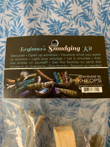 Close-up of product info tag. This is a mini smudging kit. It includes a small white sage smudging stick, a Palo Santo stick, a small smudging feather and a small abalone shell. Smudging with sage has its roots in Native American traditions. Use it to: *Cleanse, clear & purify your space or environment - home, office, *Cleanse, clear or purify a person & their energy *Promote healing *Promote clarity of mind *Clear out spiritual impurities *Enhance ceremony or ritual. Cost is $9.50.