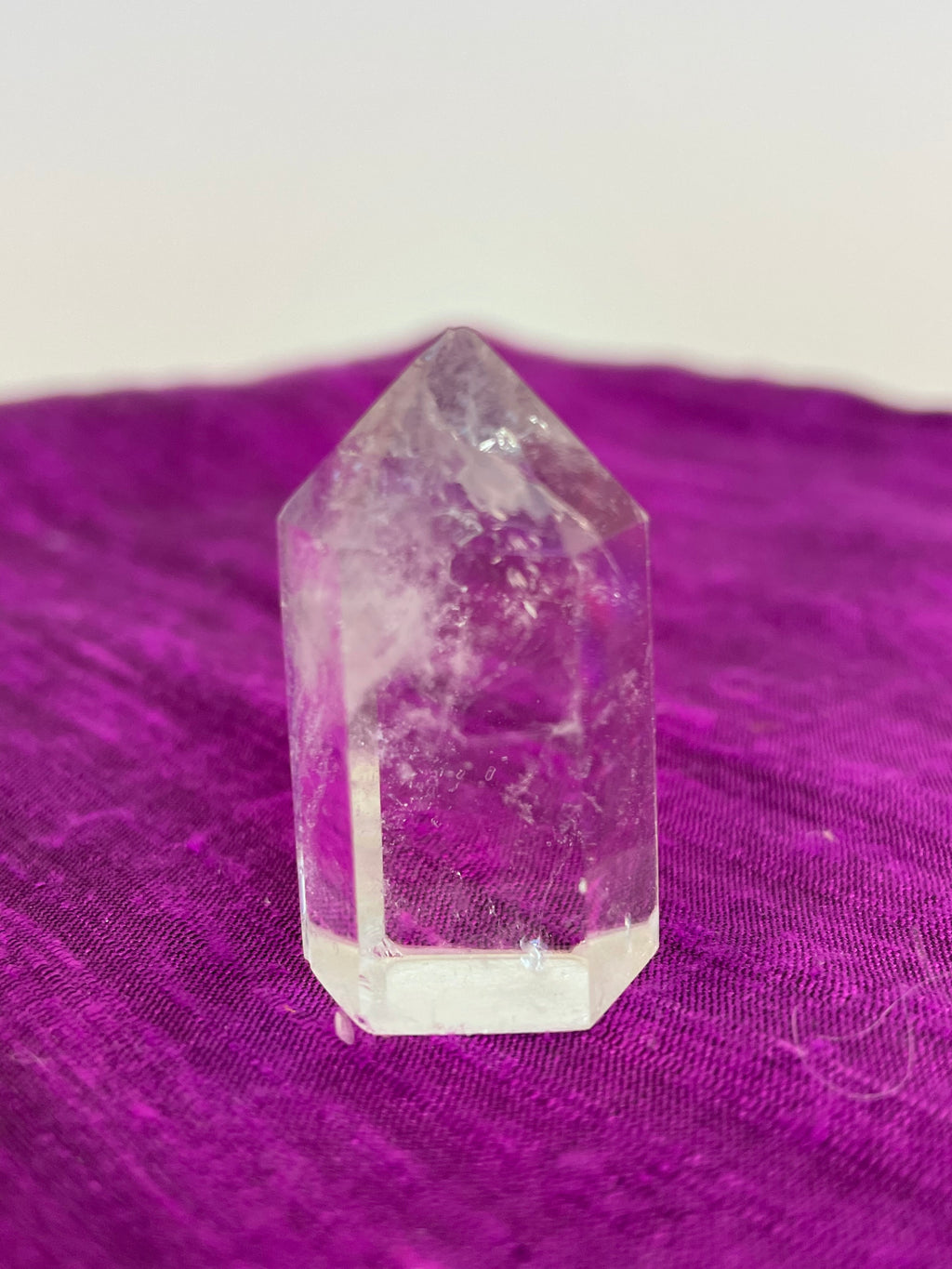 Beautiful clear crystal point holds both beauty and meaning. Quartz is the "most powerful healing and energy amplifier on the planet" (Judy Hall). It is cleansing to organs of the physical body and It also cleanses the soul and it increases your spiritual energy to the highest level (and so much more).  Place this on your altar, book shelf, nightstand or table. Use for meditation, healing, cleansing and more. Point is approximately 1½" tall. Cost is $5.98.