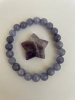 Load image into Gallery viewer, This chevron amethyst star can be used for meditation, healing, for your altar or as décor for any room in your home or office. Easy to slip right into your pocket so you have the energy of amethyst everywhere you go! Approximately 1¼&quot;. Cost is $6.
