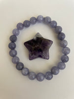 Load image into Gallery viewer, Love the way the white quartz in this chevron amethyst star tips the point of the star! It can be used for meditation, healing, for your altar or as décor for any room in your home or office. Easy to slip right into your pocket so you have the energy of amethyst everywhere you go. Approximately 1¼&quot;. Cost is $6. 
