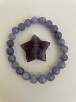 Load image into Gallery viewer, Love this little chevron amethyst star! The white quartz tips one of the points of the star.  It can be used for meditation, healing, for your altar or as décor for any room in your home or office. Easy to slip right into your pocket so you have the energy of amethyst everywhere you go. Approximately 1¼&quot;. Cost is $6.
