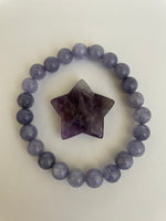 Load image into Gallery viewer, Reverse side of amethyst star. Love this little chevron amethyst star! The white quartz tips one of the points of the star. It can be used for meditation, healing, for your altar or as décor for any room in your home or office. Easy to slip right into your pocket so you have the energy of amethyst everywhere you go. Approximately 1¼&quot;. Cost is $6.
