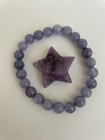 Load image into Gallery viewer, This lovely little Lepidolite star can be used for meditation, healing, for your altar, on your computer to clear EMRs, or as décor for any room in your home or office. Easy to slip right into your pocket so you can take the energy of lepidolite everywhere you go.  Approximately 1¼&quot;. Cost is $6.
