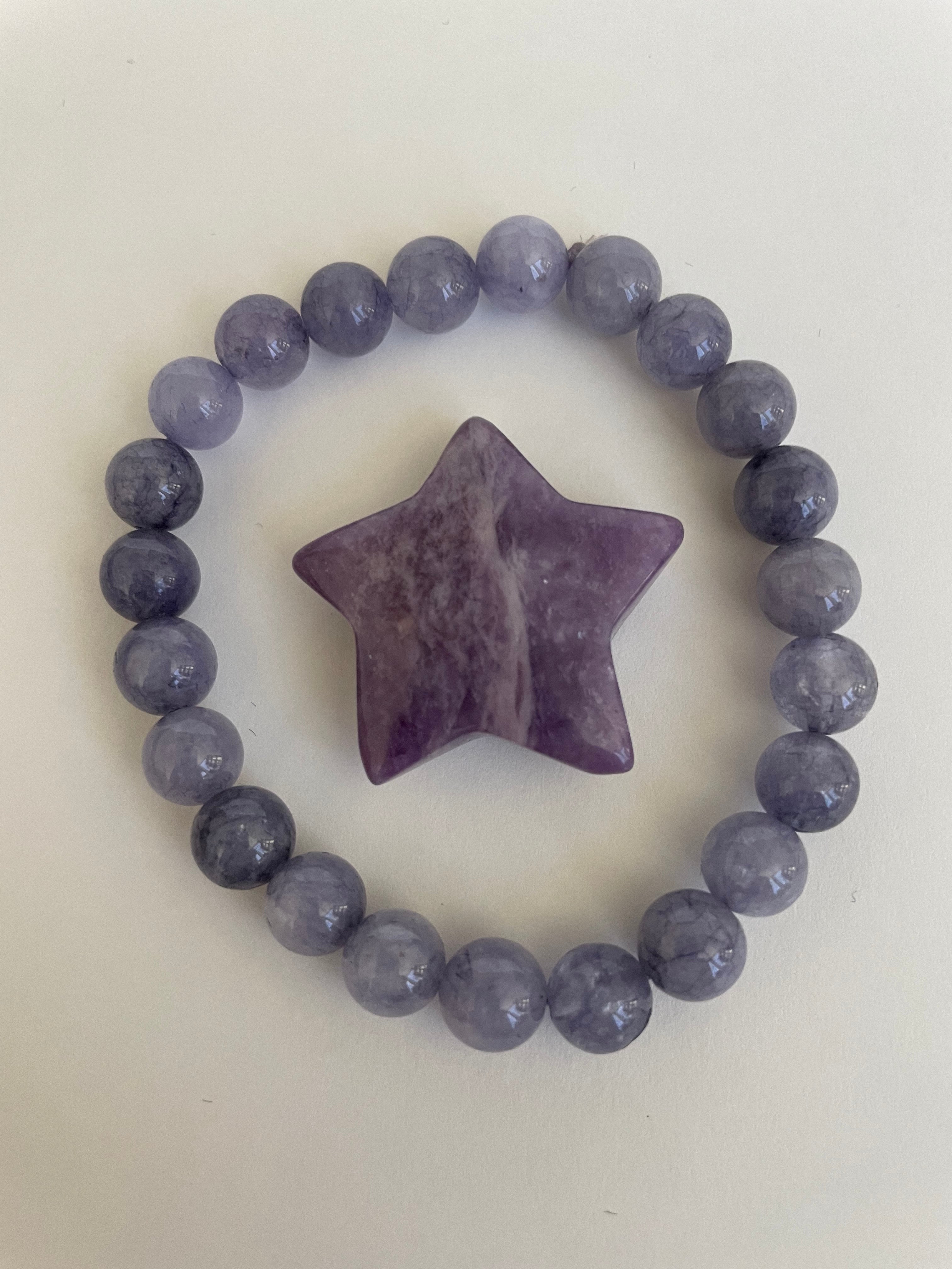 Reverse side of lepidolite star. This lovely little Lepidolite star can be used for meditation, healing, for your altar, on your computer to clear EMRs, or as décor for any room in your home or office. Easy to slip right into your pocket so you can take the energy of lepidolite everywhere you go. Approximately 1¼". Cost is $6.