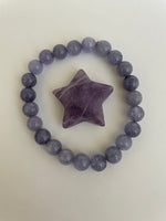 Load image into Gallery viewer, This lovely little Lepidolite star can be used for meditation, healing, for your altar, on your computer to clear EMRs, or as décor for any room in your home or office. Easy to slip right into your pocket so you can take the energy of lepidolite everywhere you go. Approximately 1¼&quot;. Cost is $6.
