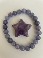 Load image into Gallery viewer, Reverse side of lepidolite star. This lovely little Lepidolite star can be used for meditation, healing, for your altar, on your computer to clear EMRs, or as décor for any room in your home or office. Easy to slip right into your pocket so you can take the energy of lepidolite everywhere you go. Approximately 1¼&quot;. Cost is $6
