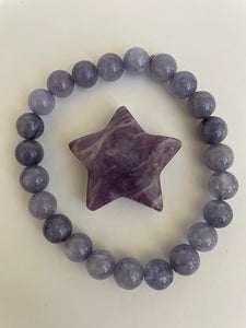 Reverse side of lepidolite star. This lovely little Lepidolite star can be used for meditation, healing, for your altar, on your computer to clear EMRs, or as décor for any room in your home or office. Easy to slip right into your pocket so you can take the energy of lepidolite everywhere you go. Approximately 1¼". Cost is $6