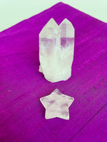Load image into Gallery viewer, Reverse side of quartz crystal star. This powerful little quartz crystal star can be used for meditation, healing, for your altar, or as décor for any room in your home or office. Easy to slip right into your pocket so you can take the energy of Quartz everywhere you go. Quartz is the &quot;most powerful healing and energy amplifier on the planet&quot; (Judy Hall). Approximately 1¼&quot;. Cost is $6.
