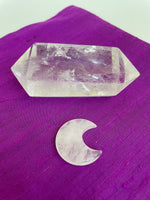 Load image into Gallery viewer, This powerful little quartz crystal crescent moon can be used for meditation, healing, for your altar, or as décor for any room in your home or office. Easy to slip right into your pocket so you can take the energy of quartz everywhere you go.  Quartz is the &quot;most powerful healing and energy amplifier on the planet&quot; (Judy Hall). Approx. 1¼&quot;. Cost is $6. 
