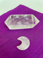 Load image into Gallery viewer, Reverse side of quartz crystal crescent moon. This powerful little quartz crystal crescent moon can be used for meditation, healing, for your altar, or as décor for any room in your home or office. Easy to slip right into your pocket so you can take the energy of quartz everywhere you go. Quartz is the &quot;most powerful healing and energy amplifier on the planet&quot; (Judy Hall). Approx. 1¼&quot;. Cost is $6.

