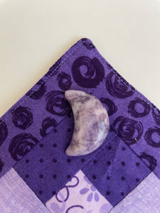 Reverse side of lepidolite crescent moon. This sparkly little lavender colored lepidolite crescent moon can be used for meditation, healing, for your altar, on/near your computer or as décor for any room in your home or office. Easy to slip right into your pocket so you can take the energy of lepidolite everywhere you go. Approx. 1¼". Cost is $6.