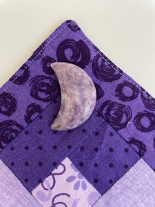 Reverse side of lepidolite crescent moon. This sparkly little lepidolite crescent moon can be used for meditation, healing, for your altar, on/near your computer or as décor for any room in your home or office. Easy to slip right into your pocket so you can take the energy of lepidolite everywhere you go. Approx. 1¼". Cost is $6.