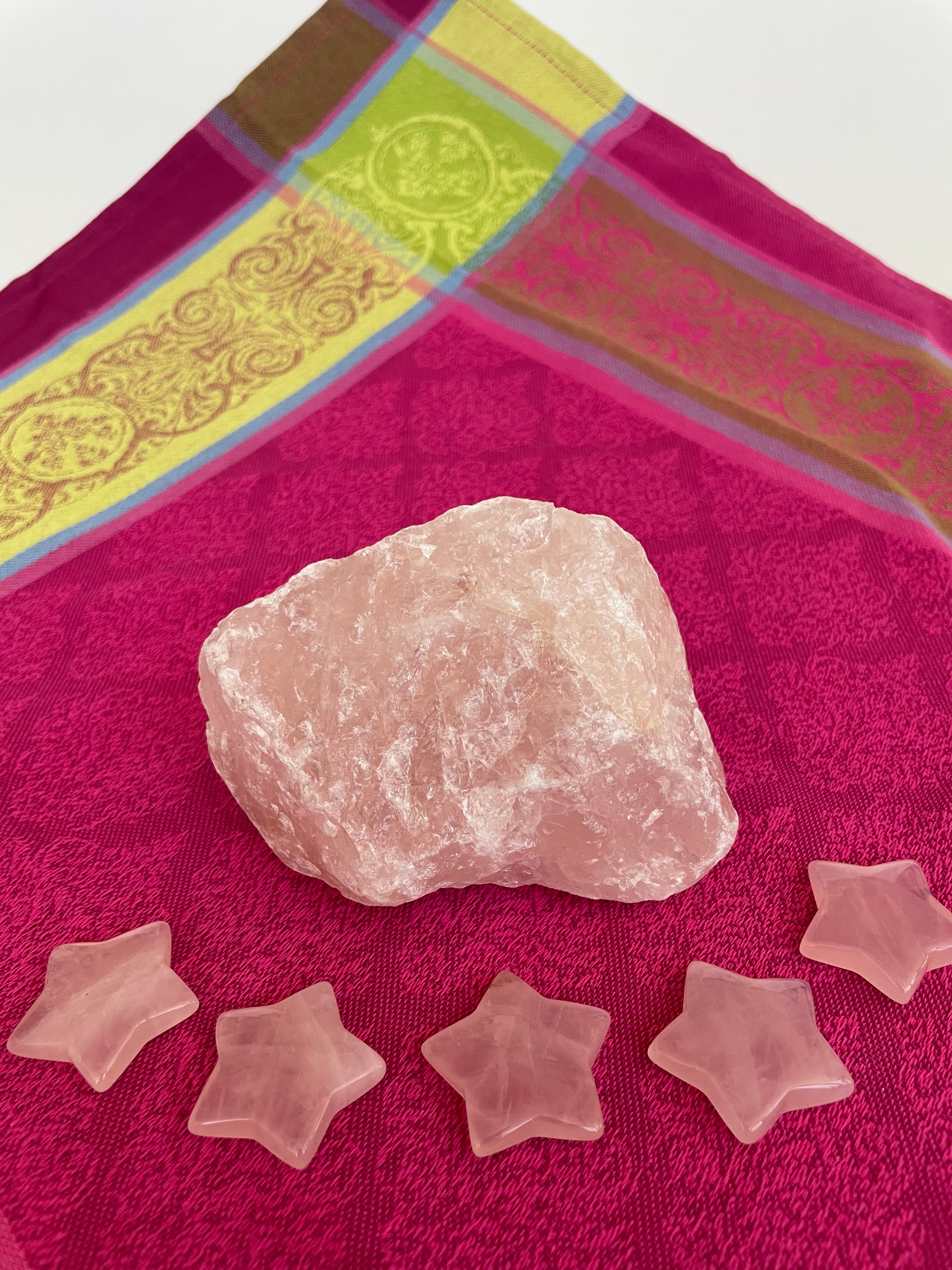 View of several rose quartz stars. This sweet little rose quartz crystal star can be used for meditation, healing, as an altar piece or as décor for any room in your home or office. Makes a wonderful gift too! Easy to slip right into your pocket so you can take the energy of rose quartz wherever you go! Rose quartz is the "stone of unconditional love & infinite peace." (Judy Hall). Approx. 1¼". Cost is $6.