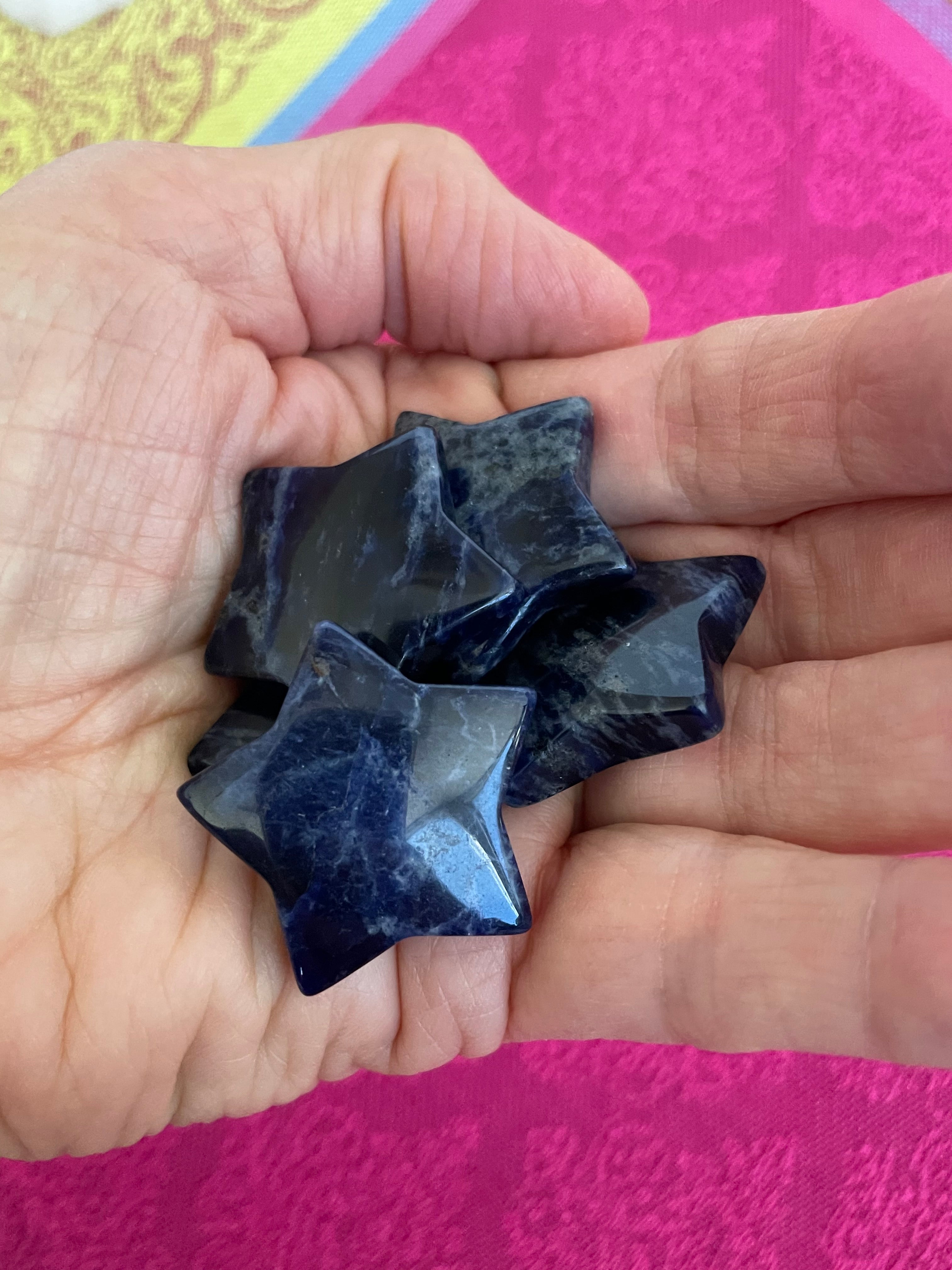 View of several sodalite stars. ﻿This powerful little sodalite crystal star can be used for meditation, healing, as an altar piece or as décor for any room in your home or office. Makes a wonderful gift too! Easy to slip right into your pocket so you can take the energy of sodalite wherever you go! Sodalite "Unites logic with intuition and opens spiritual perception" (Judy Hall). Approx. 1¼". Cost is $6 for one star. 