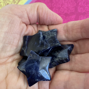 View of several sodalite stars. This powerful little sodalite crystal star can be used for meditation, healing, as an altar piece or as décor for any room in your home or office. Makes a wonderful gift too! Easy to slip right into your pocket so you can take the energy of sodalite wherever you go! Sodalite "Unites logic with intuition and opens spiritual perception" (Judy Hall). Approx. 1¼". Cost is $6 for one star.