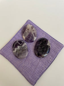 Alternate view of Chevron amethyst palm stone. Beautiful amethyst palm stone can be used for meditation, healing, for your altar or as a décor item. Amethyst, one of the most spiritual gemstones, heals, cleanses & calms, allowing you to reach meditative & higher consciousness levels more easily. It also helps to dispel negative emotional states and more. Chevron amethyst is a combination of amethyst and white quartz and when you add the quartz you get additional qualities. 2" long. Cost $12.