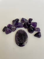 Load image into Gallery viewer, Other side of Chevron amethyst palm stone. Beautiful amethyst palm stone can be used for meditation, healing, for your altar or as a décor item. Amethyst, one of the most spiritual gemstones, heals, cleanses &amp; calms, allowing you to reach meditative &amp; higher consciousness levels more easily. It also helps to dispel negative emotional states and more. Chevron amethyst is a combination of amethyst and white quartz and when you add the quartz you get additional qualities. 2&quot; long. Cost $12.
