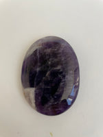 Load image into Gallery viewer, Front side of Chevron amethyst palm stone. Beautiful amethyst palm stone can be used for meditation, healing, for your altar or as a décor item. Amethyst, one of the most spiritual gemstones, heals, cleanses &amp; calms, allowing you to reach meditative &amp; higher consciousness levels more easily. It also helps to dispel negative emotional states and more. Chevron amethyst is a combination of amethyst and white quartz and when you add the quartz you get additional qualities. 2&quot; long. Cost $12.
