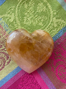 Alternate view/front. Beautiful citrine heart! Great to place on your altar or bookshelf, to hold during meditation, to use for healing or as a décor item in your home of office. Citrine absorbs and dispels negative energy, is a stone of abundance - attracting money, prosperity and success, is warming & energizing, enhances creativity, brings a positive attitude, is cleansing and more. This citrine heart is approximately 2" at it's widest expanse. Cost $22.