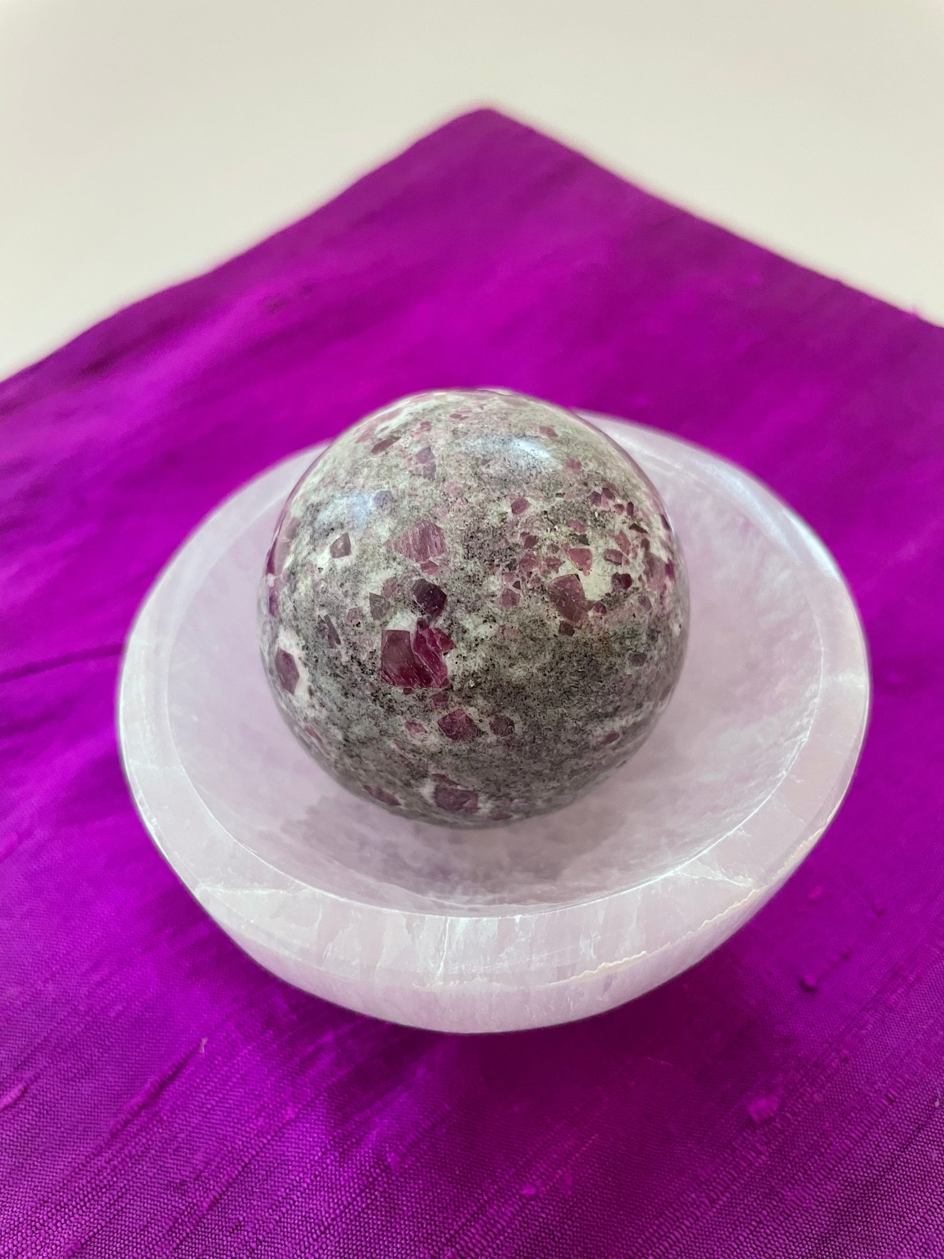 Alternate view. Ruby in matrix sphere is perfect for your altar, for meditation, as décor in your home or office. It consists of rubies set in their natural stone matrix or base. Ruby balances the heart, increases energy levels. It is a stone of love and passion and sexuality. It protects against psychic attack. It is a stone of prosperity and helps you to draw in abundance and maintain wealth. It enhances courage and leadership & more. This sphere weighs 5.2 oz. Approx. 6" in circumference. $36.00.