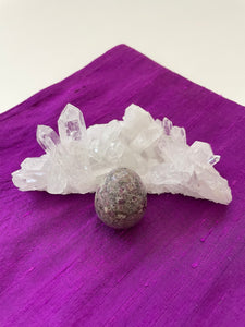 This gorgeous ruby in matrix egg is perfect for your altar, for healing, to hold during meditation, or as décor in your home or office. It consists of rubies set in their natural stone matrix or base. Ruby balances the heart & increases energy levels. It is a stone of love and passion and sexuality. It protects against psychic attack. It is a stone of prosperity. It enhances courage and leadership and much more. This sphere weighs 5.1 oz (144.58 grams) and is approximately 5¾" in circumference. Cost $9.