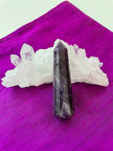 Gorgeous, 16-sided amethyst healing wand, with stunning craftsmanship. This high quality, deep purple amethyst wand can be used for healing and works especially well for "people recovering from any type of poor health - emotional, mental, physical or spiritual "and can aid in finding one's true path (ravenscrystals.com). It is approx. 3½" long. Cost is $30.