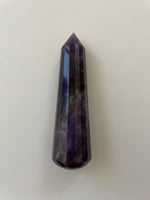 Load image into Gallery viewer, Alternate view. Gorgeous, 16-sided amethyst healing wand, with stunning craftsmanship. This high quality, deep purple amethyst wand can be used for healing and works especially well for &quot;people recovering from any type of poor health - emotional, mental, physical or spiritual &quot;and can aid in finding one&#39;s true path (ravenscrystals.com). It is approx. 3½&quot; long. Cost is $30.

