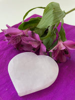 Load image into Gallery viewer, Lovely heart-shaped selenite plate, which can be used for cleansing and charging your crystals and jewelry because it dispels negative and unwanted energies. Selenite also promotes clarity of mind, opens the crown chakra, helps to access angelic energies and guidance from the higher realms. It brings peace and is a great stone to use while meditating or connecting spiritually and more. Approx. 3&quot; across. Cost is only $5.

