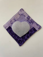 Load image into Gallery viewer, Alternate view. Lovely heart-shaped selenite plate, which can be used for cleansing and charging your crystals and jewelry because it dispels negative and unwanted energies. Selenite also promotes clarity of mind, opens the crown chakra, helps to access angelic energies and guidance from the higher realms. It brings peace and is a great stone to use while meditating or connecting spiritually and more. Approx. 3&quot; across. Cost is only $5.
