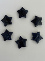 Load image into Gallery viewer, Yet another view of several sodalite stars. This powerful little sodalite crystal star can be used for meditation, healing, as an altar piece or as décor for any room in your home or office. Makes a wonderful gift too! Easy to slip right into your pocket so you can take the energy of sodalite wherever you go! Sodalite &quot;Unites logic with intuition and opens spiritual perception&quot; (Judy Hall). Approx. 1¼&quot;. Cost is $6 for one star.
