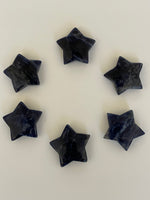Load image into Gallery viewer, Yet another view of several sodalite stars. This powerful little sodalite crystal star can be used for meditation, healing, as an altar piece or as décor for any room in your home or office. Makes a wonderful gift too! Easy to slip right into your pocket so you can take the energy of sodalite wherever you go! Sodalite &quot;Unites logic with intuition and opens spiritual perception&quot; (Judy Hall). Approx. 1¼&quot;. Cost is $6 for one star.
