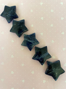 Another view of several sodalite stars. This powerful little sodalite crystal star can be used for meditation, healing, as an altar piece or as décor for any room in your home or office. Makes a wonderful gift too! Easy to slip right into your pocket so you can take the energy of sodalite wherever you go! Sodalite "Unites logic with intuition and opens spiritual perception" (Judy Hall). Approx. 1¼". Cost is $6 for one star.