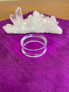 Your basic clear plastic ring to display crystal spheres or eggs. Use to keep your crystal spheres and eggs in place, rather than rolling off your altar, table or nightstand - lol.  This is the largest size I have at approximately 1.8"x 06" (d/h). The 3rd photo shows all three sizes I offer.  Check out my crystal spheres and my ruby-in-matrix eggs and Judy Hall's The Crystal Bible Books - they are awesome! Cost is $1.00 (and must be purchased as an add-on item).