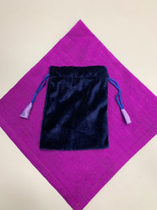 A third view of the bag. Small Purple (maybe very dark blue) velvet oracle deck/tarot bag lined with lavender satin. It is plain velvet without a design, but with drawstrings for closure. It is 5.75"x4.75" and suitable for small oracle or tarot decks (e.g. Shamanic Healing Oracle Cards or The Original Angel Cards). It can also be used to hold and protect small to medium size crystals, gemstones or other precious items. Cost is $4.99