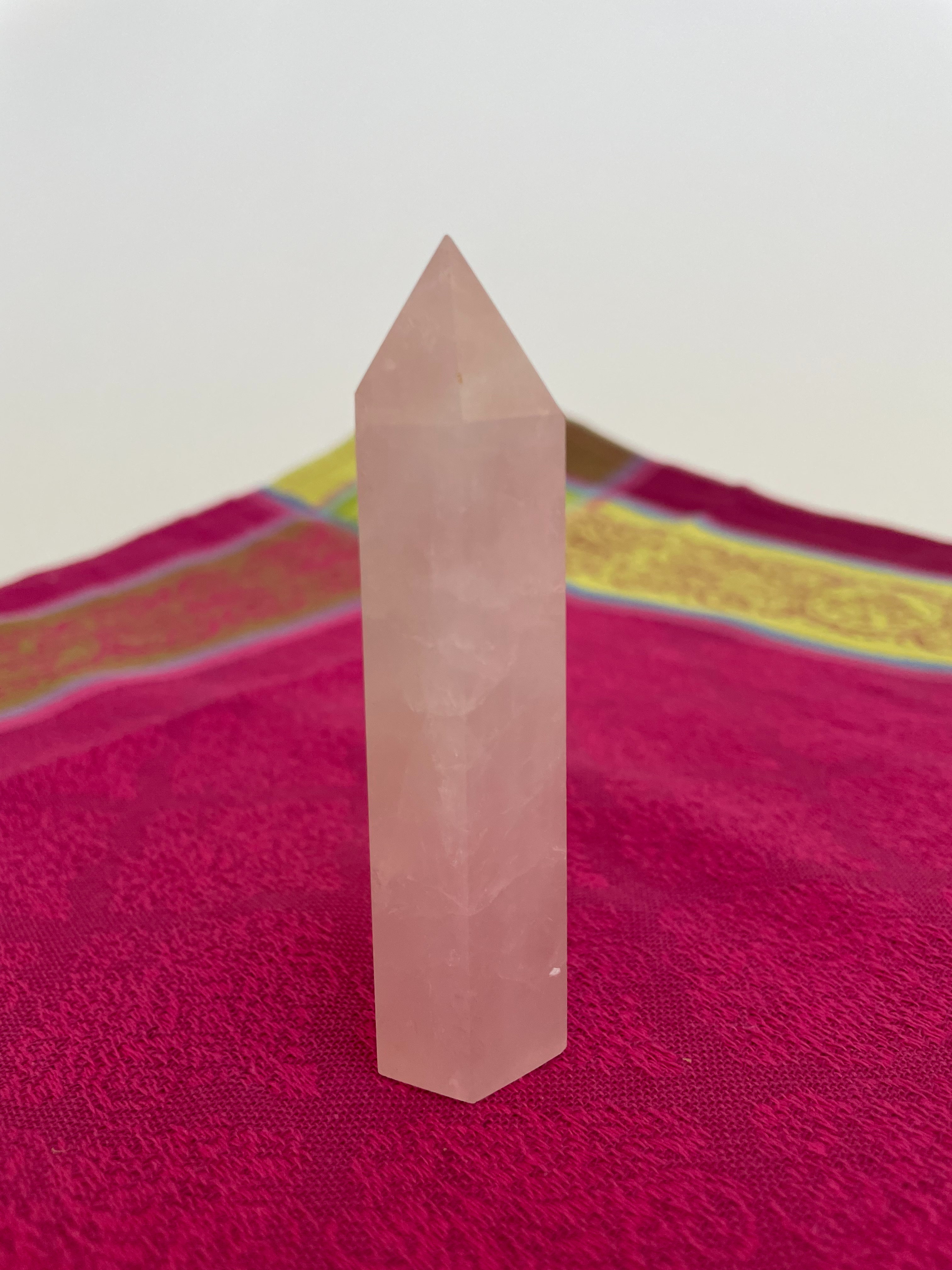 Alternate view. Rose Quartz tower of love 💗. Beautiful rose quartz tower for your altar, for healing or as décor for any room in your home or office. Rose quartz is the ultimate love stone, for love of all types - to attract love and for self-love. It is soothing, enhances compassion, is the best emotional healer, dispels negative energy, opens your heart and so much more. Approx. 3¾" long. See photos below for views of all sides. Cost is $18.00.