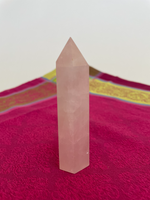 Load image into Gallery viewer, Alternate view. Rose Quartz tower of love 💗. Beautiful rose quartz tower for your altar, for healing or as décor for any room in your home or office. Rose quartz is the ultimate love stone, for love of all types - to attract love and for self-love. It is soothing, enhances compassion, is the best emotional healer, dispels negative energy, opens your heart and so much more. Approx. 3¾&quot; long. See photos below for views of all sides. Cost is $18.00.
