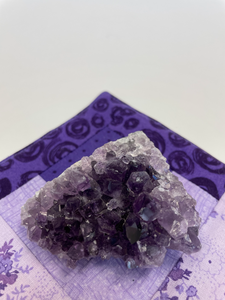 Glittering amethyst geode piece is lovely to use for its properties and also as a lovely piece for your altar, bookshelf or nightstand. Amethyst, one of the most spiritual gemstones, heals, cleanses & calms, allowing you to reach meditative & higher consciousness levels more easily. It also helps to dispel negative emotional states (and so much more). Cost $5.98.
